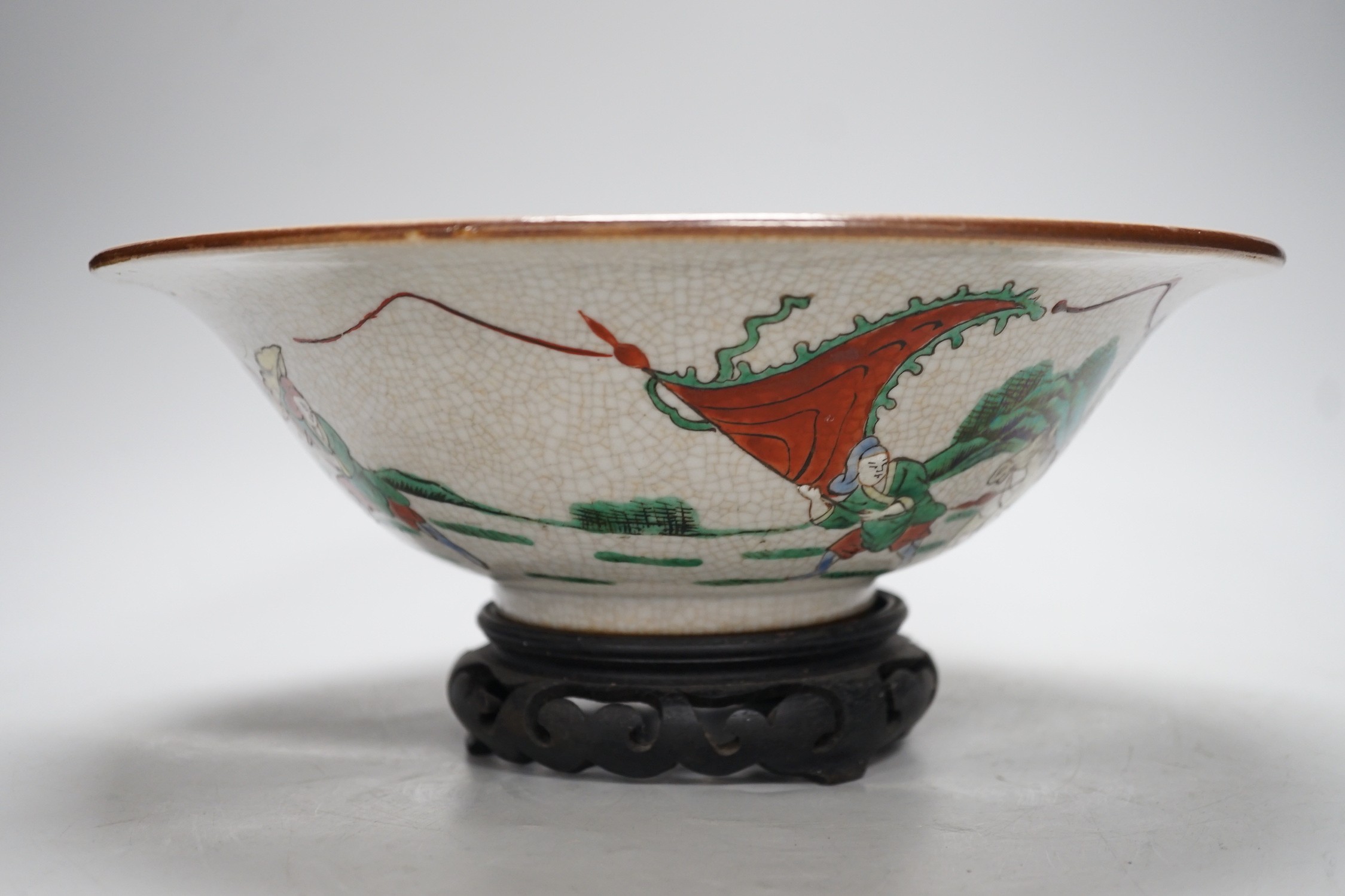 A Chinese famille verte crackle glaze ‘Eight Immortals’ bowl, early 20th century, 29cm diameter, on hardwood stand